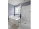 Modern bathroom with a soaking tub, and a shower with white tile and glass doors at 1586 Innkeeper Ln, Johns Island, SC 29455