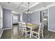 Dining room boasts a modern chandelier, coffered ceiling, and a large dining table with seating at 1586 Innkeeper Ln, Johns Island, SC 29455