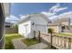 View of detached garage with white siding and concrete driveway at 1586 Innkeeper Ln, Johns Island, SC 29455
