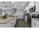 Bright kitchen boasts granite countertops, stainless appliances, and ample cabinet space at 1586 Innkeeper Ln, Johns Island, SC 29455