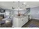Open concept kitchen features granite counters, stainless appliances, and breakfast bar seating at 1586 Innkeeper Ln, Johns Island, SC 29455