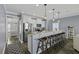 Modern kitchen featuring stainless steel appliances, granite countertops, and stylish pendant lighting at 1586 Innkeeper Ln, Johns Island, SC 29455