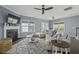 Spacious living room featuring a fireplace, TV, plush sofa, and lots of natural light at 1586 Innkeeper Ln, Johns Island, SC 29455