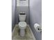 Compact powder room features a toilet and patterned linoleum flooring at 1586 Innkeeper Ln, Johns Island, SC 29455