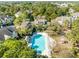 This aerial view showcases the community pool, grilling area, and townhome-style apartment buildings at 1600 Long Grove Dr # 1226, Mount Pleasant, SC 29464