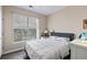 This bright bedroom features a large window, hard surface flooring, a ceiling fan, and neutral wall paint at 1600 Long Grove Dr # 1226, Mount Pleasant, SC 29464