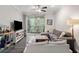 Living room with a TV, sofas, a bar cart, an area rug and sliding doors to a balcony at 1600 Long Grove Dr # 1226, Mount Pleasant, SC 29464