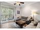Cozy living room featuring a comfortable gray sectional and sliding glass doors to the patio at 1600 Long Grove Dr # 1226, Mount Pleasant, SC 29464