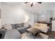Open-concept living room with a comfortable sofa, an area rug, and an entrance door to the unit at 1600 Long Grove Dr # 1226, Mount Pleasant, SC 29464