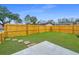Spacious backyard featuring a well-maintained lawn, stepping stones, and a wooden privacy fence at 1725 W Avalon Cir, Charleston, SC 29407