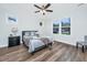 Comfortable bedroom with wood-look flooring, a ceiling fan, and great natural light at 1725 W Avalon Cir, Charleston, SC 29407