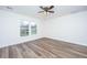 Bright bedroom featuring hardwood floors, a ceiling fan, and a window at 1725 W Avalon Cir, Charleston, SC 29407
