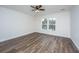 Bedroom featuring hardwood floors, a ceiling fan, and a large window at 1725 W Avalon Cir, Charleston, SC 29407