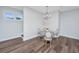 Bright dining area featuring hardwood floors and a stylish chandelier at 1725 W Avalon Cir, Charleston, SC 29407