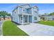 Charming two-story home with light blue siding, a front porch, and a long driveway for ample parking at 1725 W Avalon Cir, Charleston, SC 29407