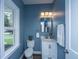 Stylish powder room featuring blue walls, and a marble vanity at 1725 W Avalon Cir, Charleston, SC 29407