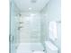 Modern shower featuring a glass enclosure, tiled walls, and convenient built-in shelving at 1725 W Avalon Cir, Charleston, SC 29407