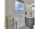 Well-lit bathroom with a vanity, towel rack, and patterned floor tiles at 1821 Mead Ln, Johns Island, SC 29455