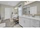 Elegant bathroom features double vanity, quartz countertop, gold fixtures, and frameless glass shower at 1821 Mead Ln, Johns Island, SC 29455