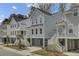 Street view of elevated homes, stairs to front entry, and covered parking at 1821 Mead Ln, Johns Island, SC 29455