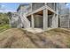 Exterior view of home with elevated structure, stairs, and a large yard at 1821 Mead Ln, Johns Island, SC 29455