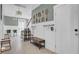 Welcoming foyer with vintage tennis rackets as decor, shaker-style trim, and a coat rack at 1821 Mead Ln, Johns Island, SC 29455