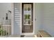 Stylish black front door with sidelight, a modern electronic deadbolt, and a cozy welcome mat at 1821 Mead Ln, Johns Island, SC 29455