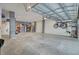 Spacious garage with concrete flooring, overhead storage, and bicycle rack at 1821 Mead Ln, Johns Island, SC 29455