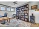 Well-appointed home office with a bookcase, a ladder, a chess table, and ample natural light at 1821 Mead Ln, Johns Island, SC 29455