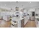 Spacious open-concept kitchen and living area featuring a fireplace and stainless steel appliances at 1821 Mead Ln, Johns Island, SC 29455