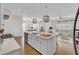 Bright, open kitchen with white cabinets, stainless appliances, and a large center island at 1821 Mead Ln, Johns Island, SC 29455