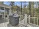 Enjoy outdoor cooking on this deck with a grill overlooking a serene wooded area at 1821 Mead Ln, Johns Island, SC 29455