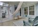 This porch offers a hammock, swing, and seating with view to the yard and access to screened porch at 1821 Mead Ln, Johns Island, SC 29455
