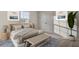 Comfortable bedroom showcasing a cozy bed, nightstand, and a decorative bench at 189 Belfort Place, Summerville, SC 29486