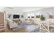 Bright living room with hardwood floors, large windows, and stylish furnishings at 189 Belfort Place, Summerville, SC 29486