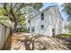 Large backyard with mature trees, privacy fence, and concrete patio perfect for entertaining at 2076 Wild Flower Ln, Charleston, SC 29414