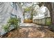 Large backyard features privacy fence and a concrete patio, perfect for outdoor enjoyment at 2076 Wild Flower Ln, Charleston, SC 29414