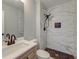 Bathroom features a vanity and walk-in shower with marble tiling at 2076 Wild Flower Ln, Charleston, SC 29414