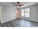 Bedroom with luxury vinyl plank flooring, a ceiling fan, and a pair of windows at 2076 Wild Flower Ln, Charleston, SC 29414