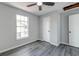 Bedroom features vinyl plank flooring, window, and closet for storage at 2076 Wild Flower Ln, Charleston, SC 29414