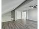 A bright bedroom features gray walls, wood-look floors, built-in shelving, and a ceiling fan at 2076 Wild Flower Ln, Charleston, SC 29414