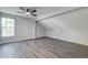 Bedroom with sloped ceiling features hardwood floors and ample natural light at 2076 Wild Flower Ln, Charleston, SC 29414