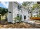 This home has a backyard with a small patio and classic white siding at 2076 Wild Flower Ln, Charleston, SC 29414