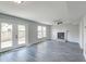 Inviting living area with a cozy fireplace, sliding glass doors, and sleek wood-look flooring at 2076 Wild Flower Ln, Charleston, SC 29414