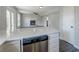Open-concept living space with a fireplace and a door to the outside with a marble counter at 2076 Wild Flower Ln, Charleston, SC 29414