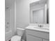 Clean bathroom featuring a tub with shower, a toilet, and a single vanity, all in pristine white at 2239 Macallan Blvd, Ravenel, SC 29470