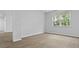 A naturally lit bedroom with a large window and light vinyl flooring at 2239 Macallan Blvd, Ravenel, SC 29470