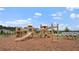 Community playground set featuring slides, wooden ladder and bridges and picnic tables at 2239 Macallan Blvd, Ravenel, SC 29470