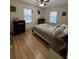 Bedroom featuring a full-sized bed, hardwood floors, and natural light at 260 Carolina Cir, Walterboro, SC 29488