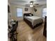 Bright bedroom with hardwood floors, natural light and hunting decor at 260 Carolina Cir, Walterboro, SC 29488